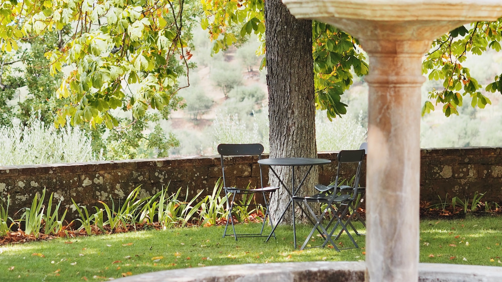 Natural stone fountain and pondless waterfall installation in a Minnesota backyard